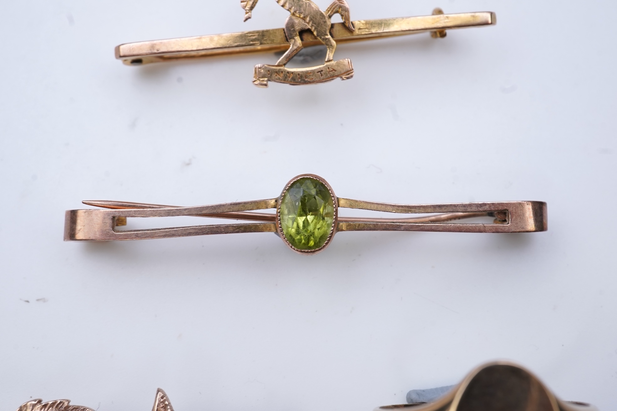 Four brooches and a gold signet ring
